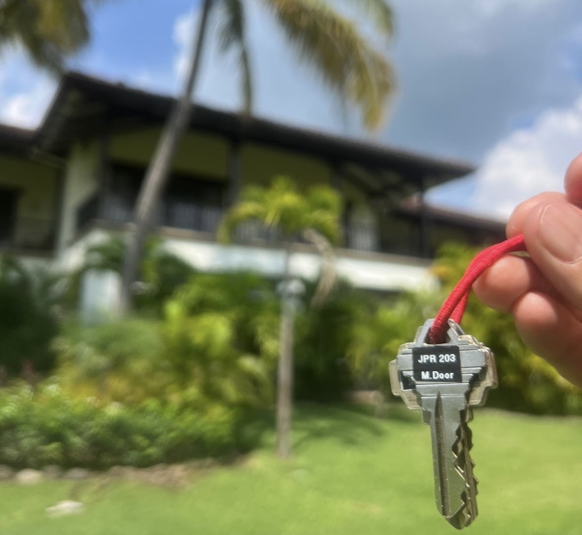 New homeowner receiving property keys in Guanacaste real estate purchase, Costa Rica